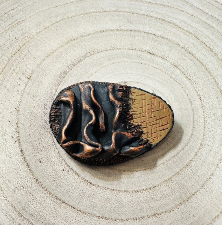Elegant Grunge brooch in black and copper with a gold textured edge by Denise Fitzsimmons