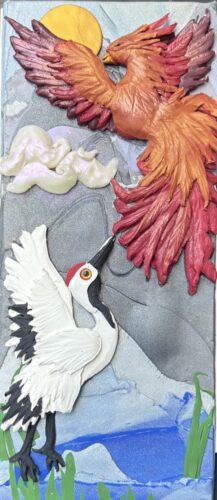 Dimensional relief panel of a phoenix and crane by Deb Jaffe